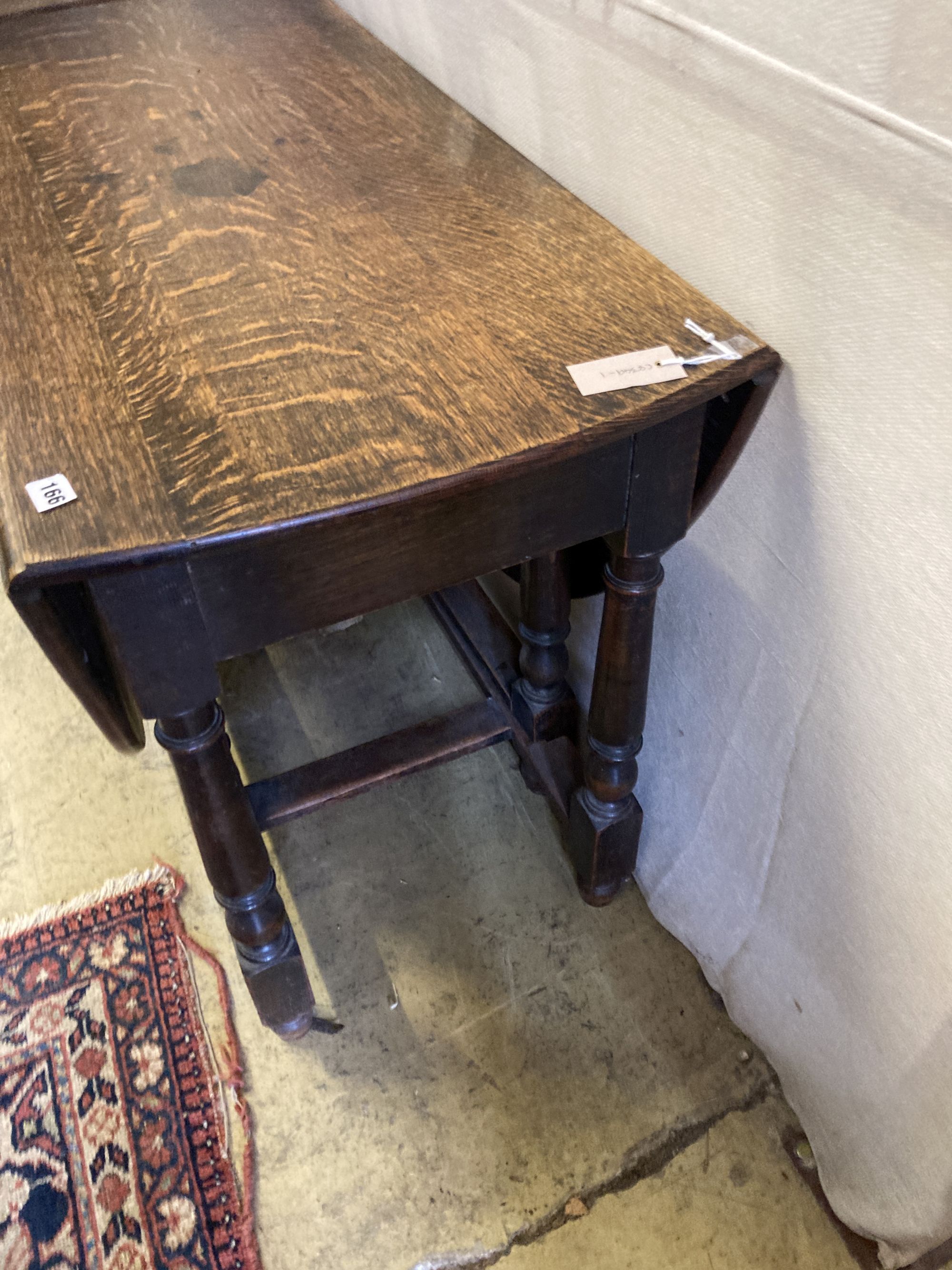 An oak gateleg dining table, length 106cm, depth 50cm, height 73cm